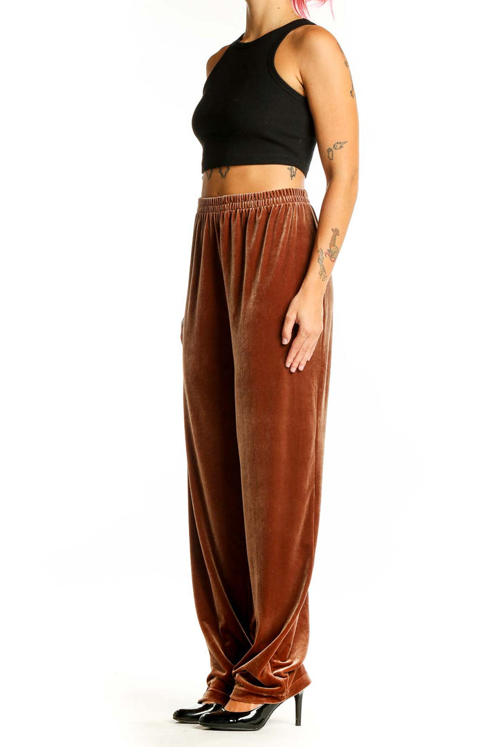 Front view of Maggie Sweet rust velvet wide-leg lounge pants on model