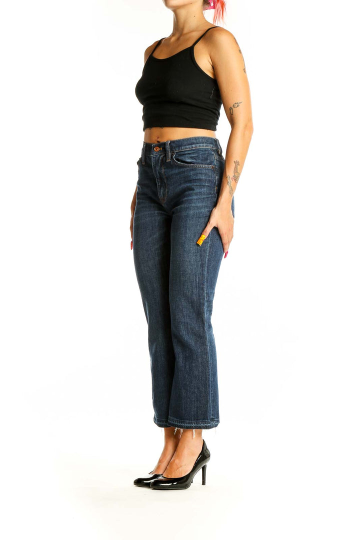 Front view of J.Crew dark blue cropped flare jeans on model