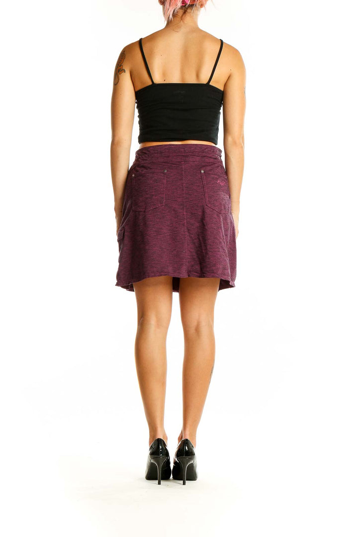 Back view of burgundy KUHL skirt showing A-line silhouette