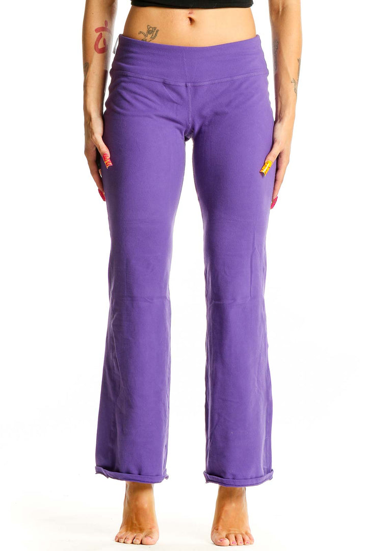 Front view of purple flared yoga pants from Beyond Yoga