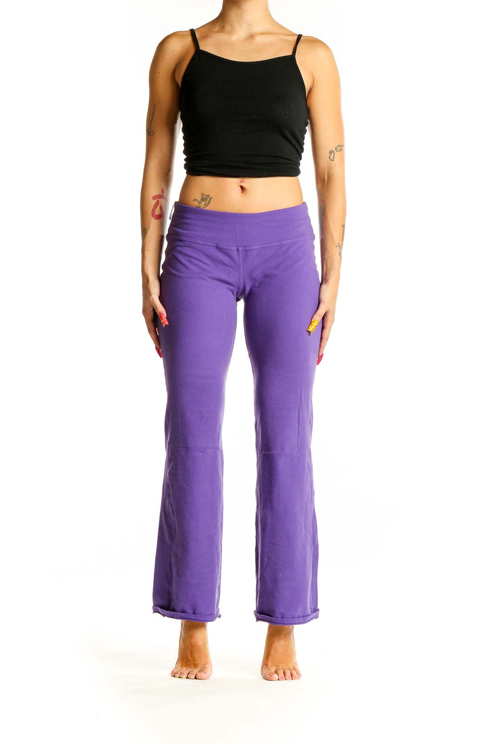 Front view of purple flared yoga pants from Beyond Yoga