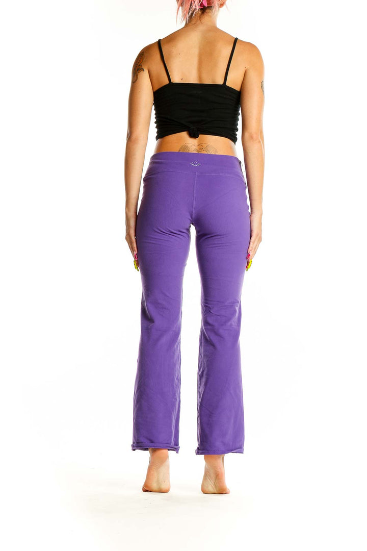 Back view of purple flared yoga pants from Beyond Yoga