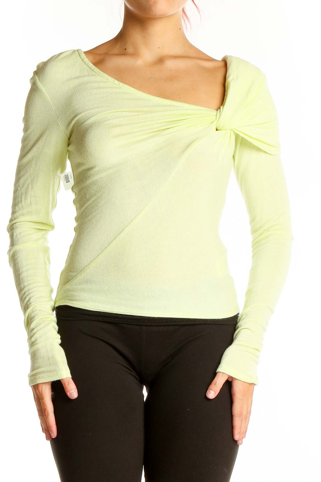 Front view of pale yellow Free People knit top with asymmetrical twist-front neckline