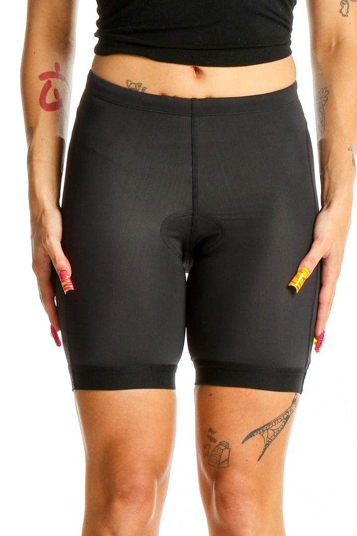 Front view of black PEARL IZUMI cycling shorts on model