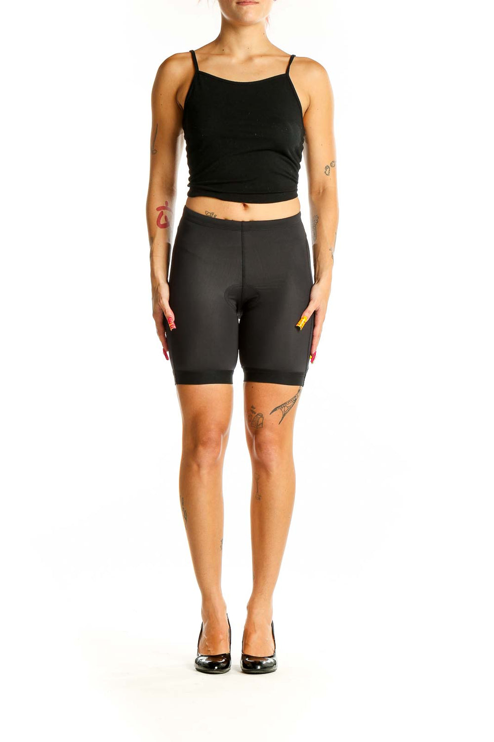 Front view of black PEARL IZUMI cycling shorts on model