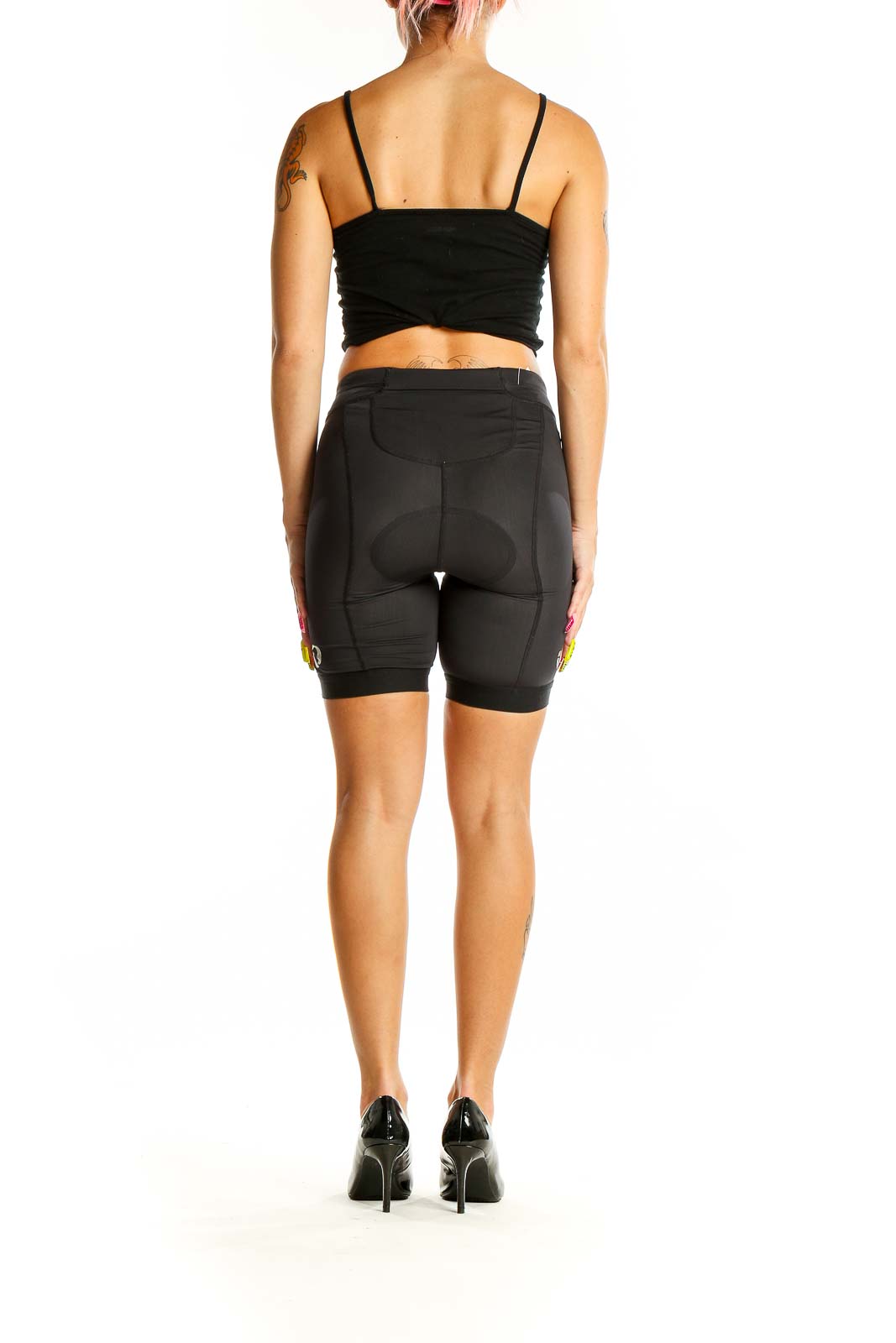 Back view of black PEARL IZUMI cycling shorts on model