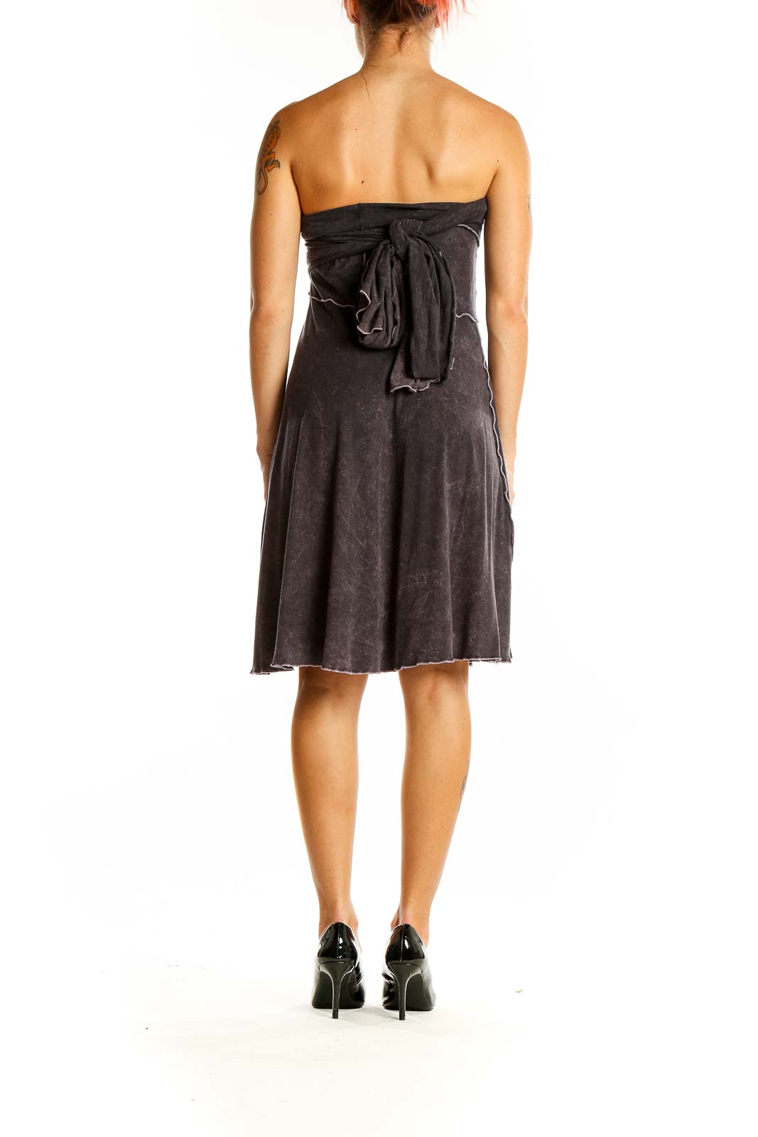 Back view of ANGELROX charcoal strapless A-line dress with tie detail