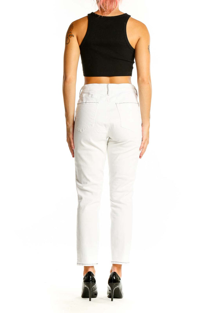 Back view of LOFT white straight leg jeans on model