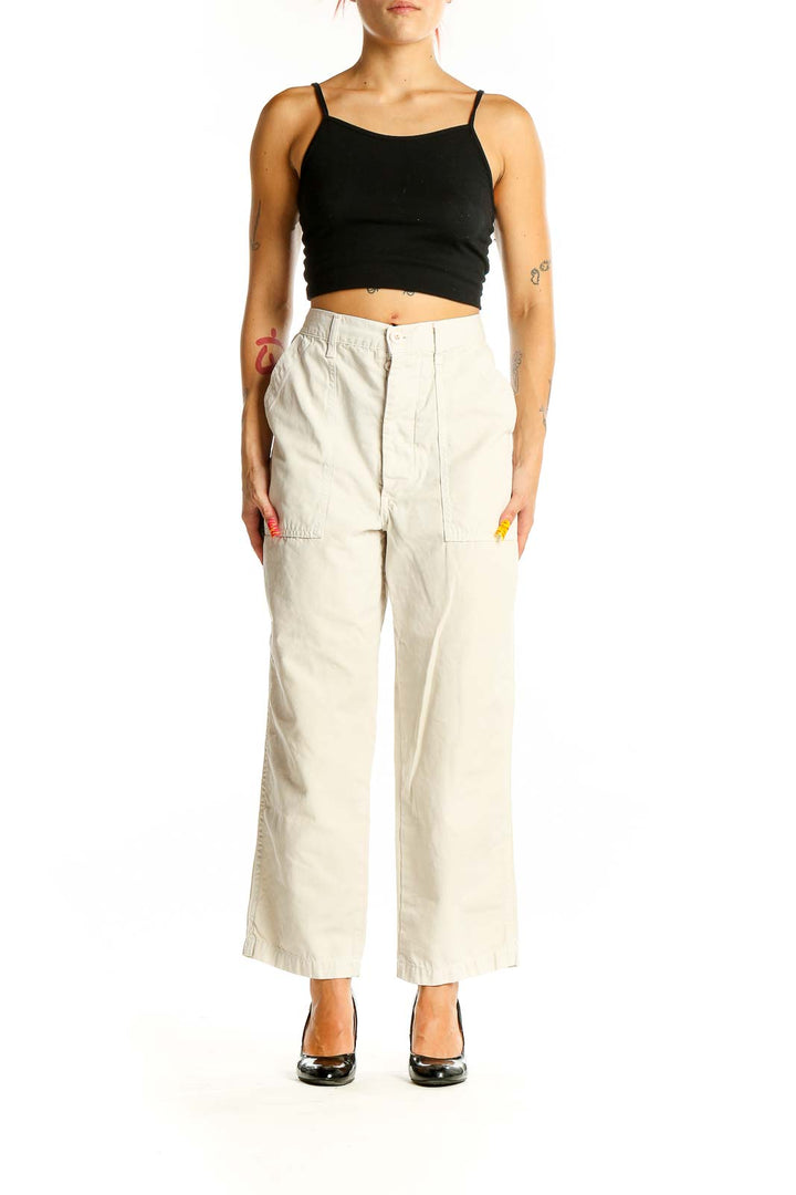 Front view of Amo beige cotton wide-leg pants with patch pockets