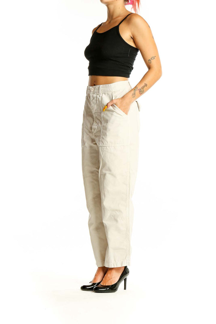 Front view of Amo beige cotton wide-leg pants with patch pockets