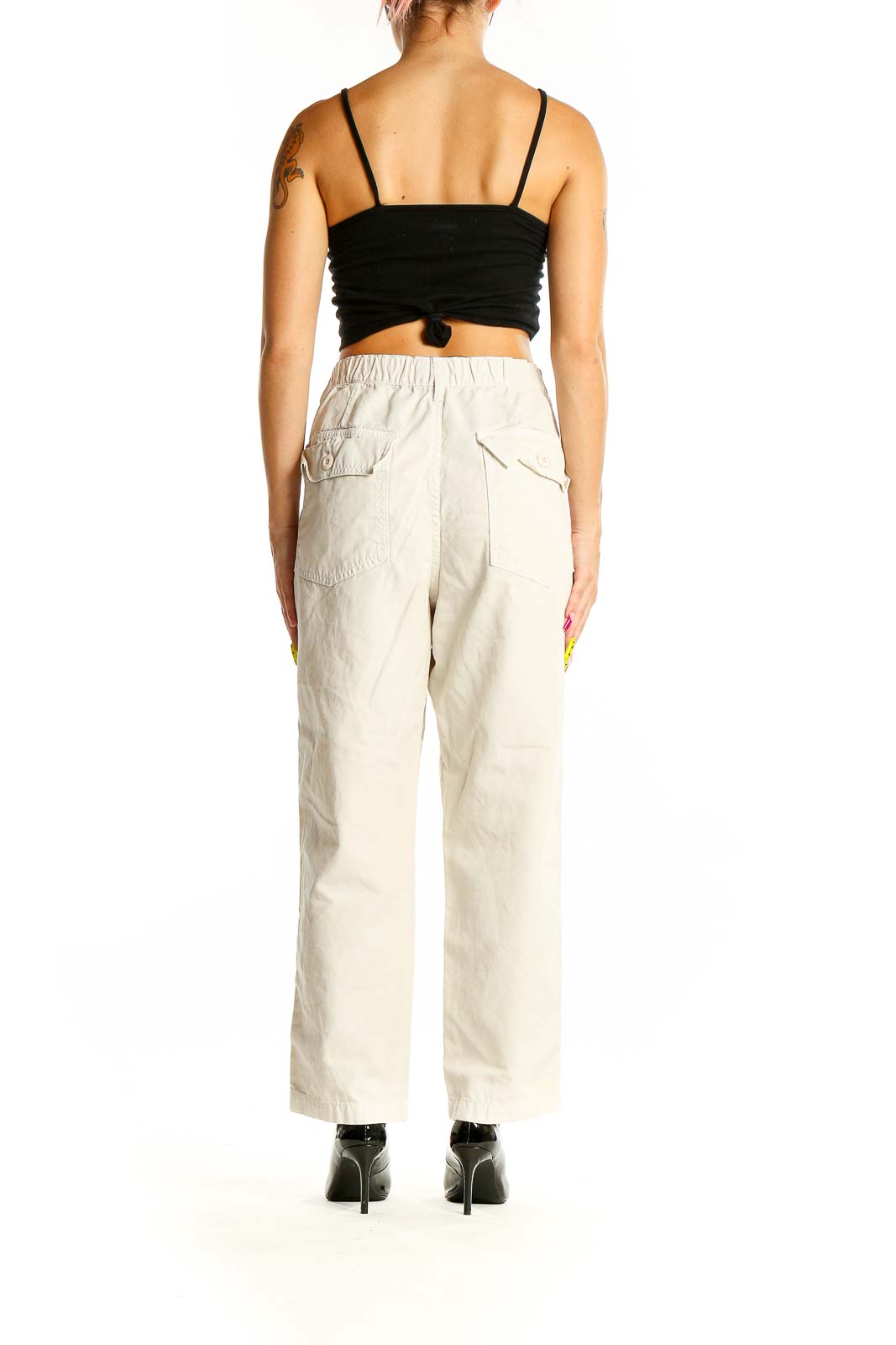 Back view of Amo beige cotton wide-leg pants showing relaxed fit