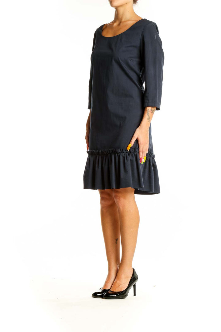 Front view of black SilkRoll dress with ruffle hem and scoop neckline