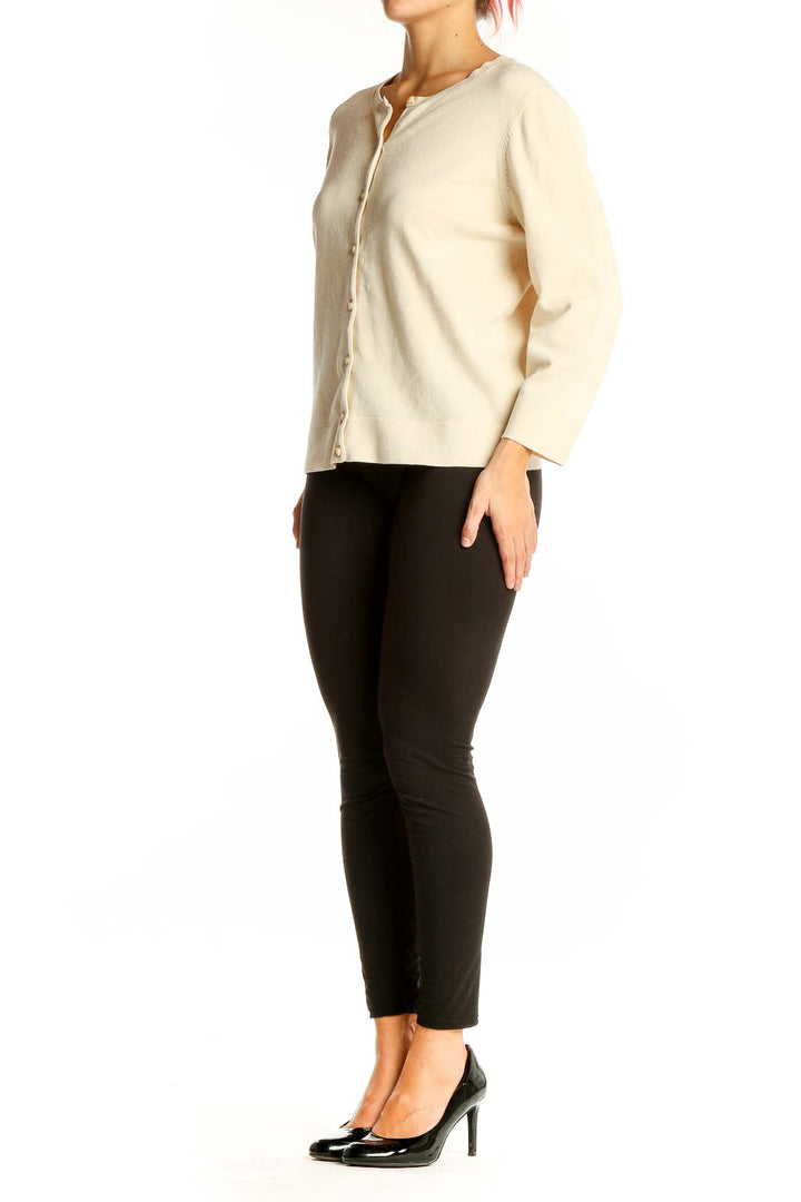 Front view of Ann Taylor cream button-front cardigan sweater