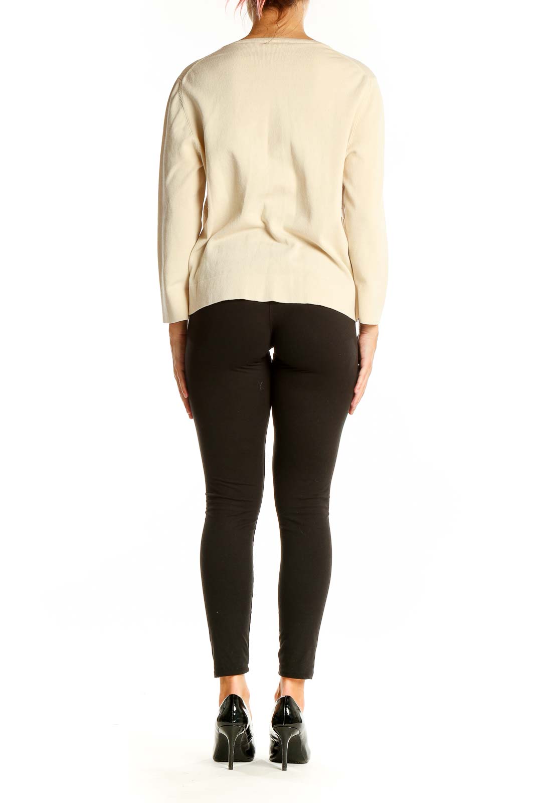 Back view of Ann Taylor cream cardigan sweater on model with black pants