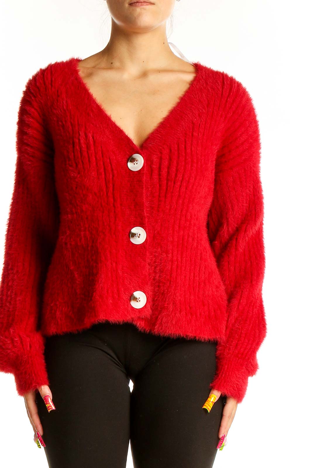 Front view of red fuzzy MINKPINK cardigan with oversized white buttons