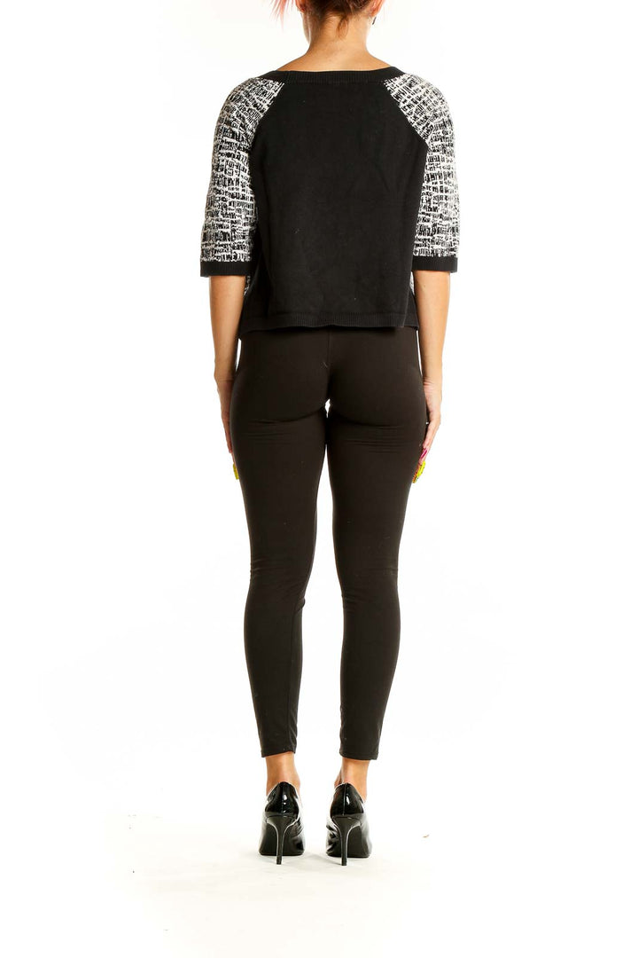 Back view of Ramy Brook Black and White Textured Crop Sweater with contrasting sleeves