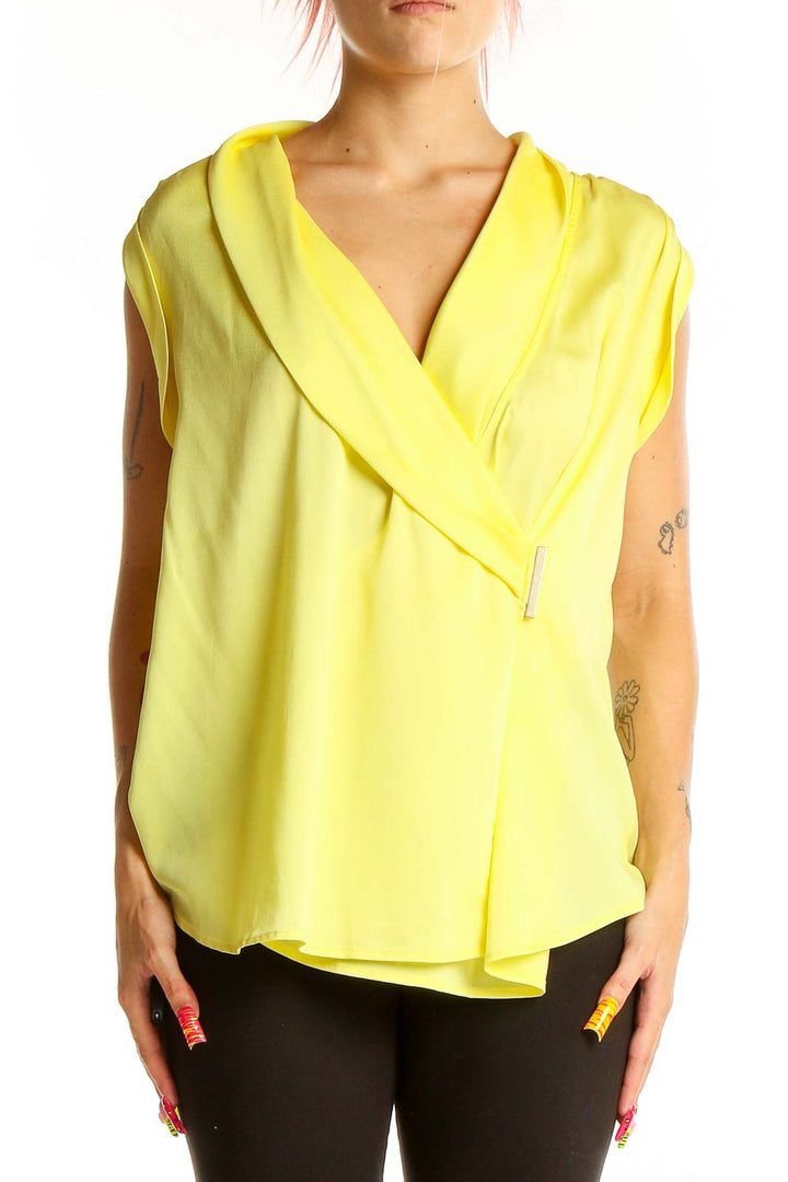 Front view of Ann Taylor yellow sleeveless wrap blouse on model