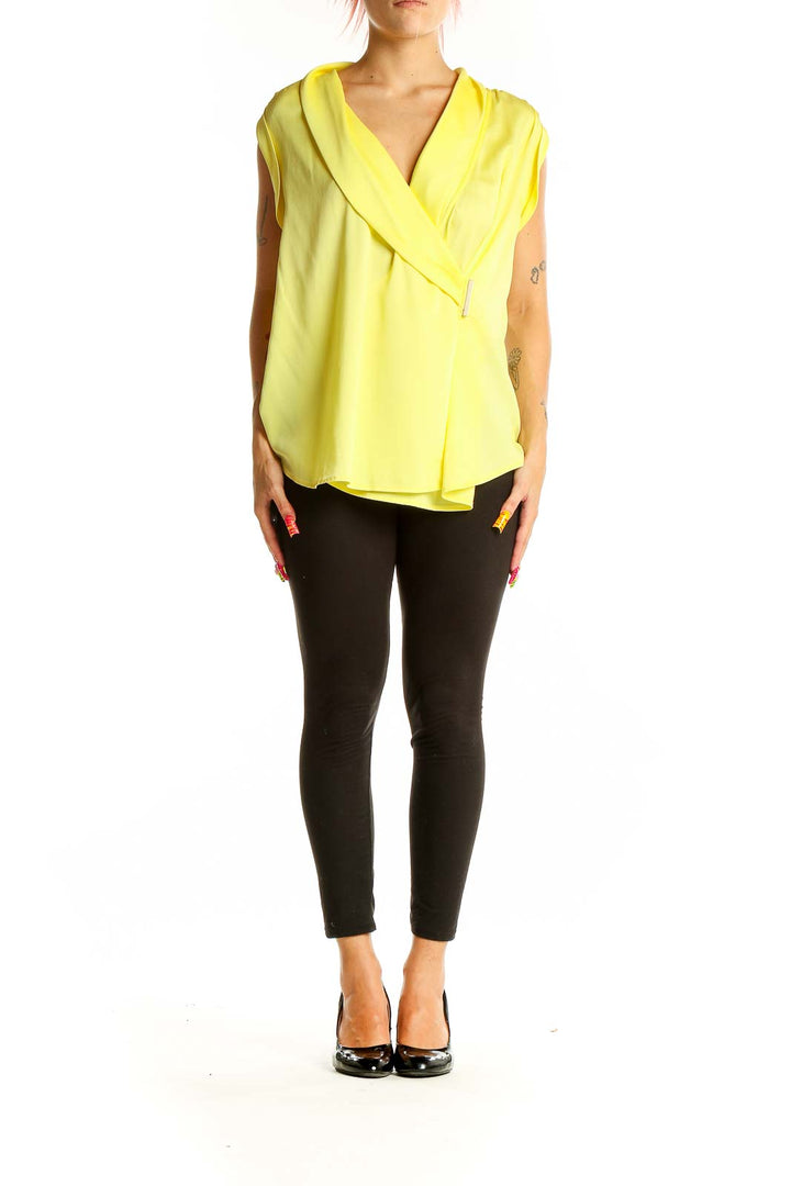 Front view of Ann Taylor yellow sleeveless wrap blouse on model