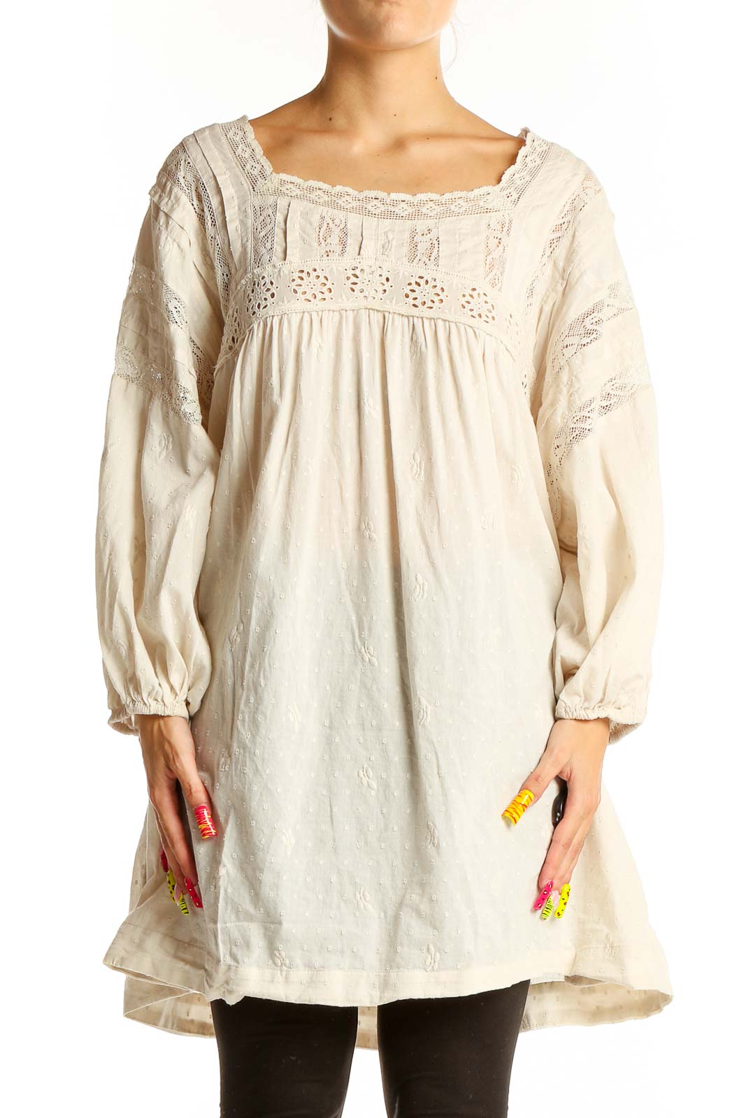 Front view of cream lace cotton dress from Free People with square neckline and long sleeves