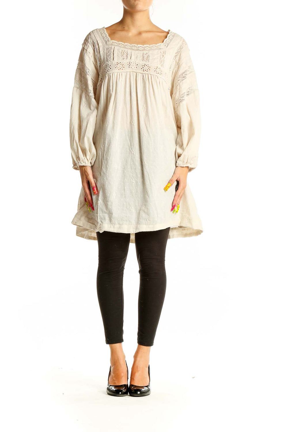 Front view of cream lace cotton dress from Free People with square neckline and long sleeves