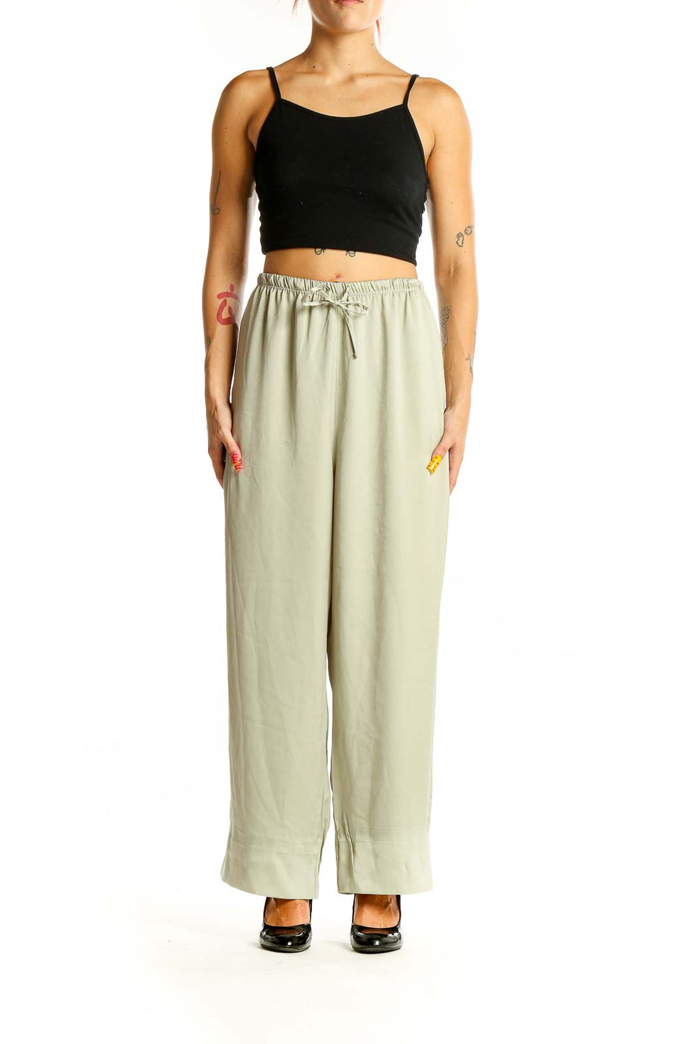 Front view of sage green Uniqlo wide-leg pants with drawstring waist