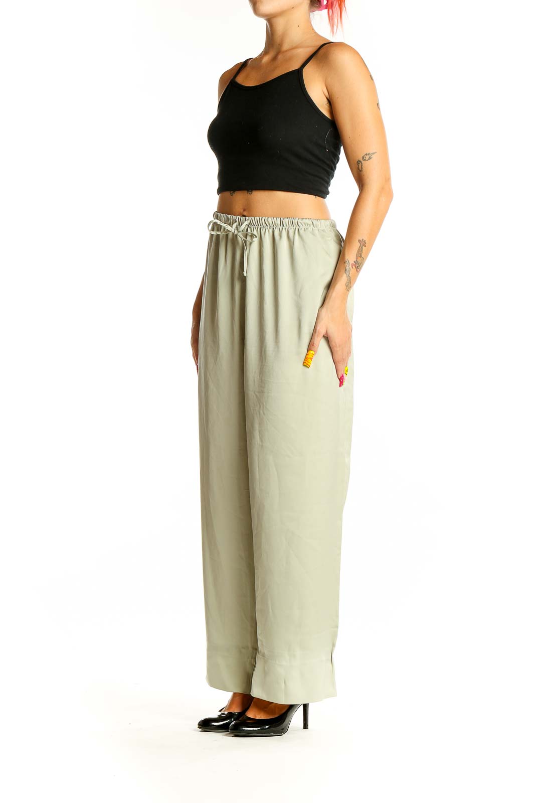 Front view of sage green Uniqlo wide-leg pants with drawstring waist