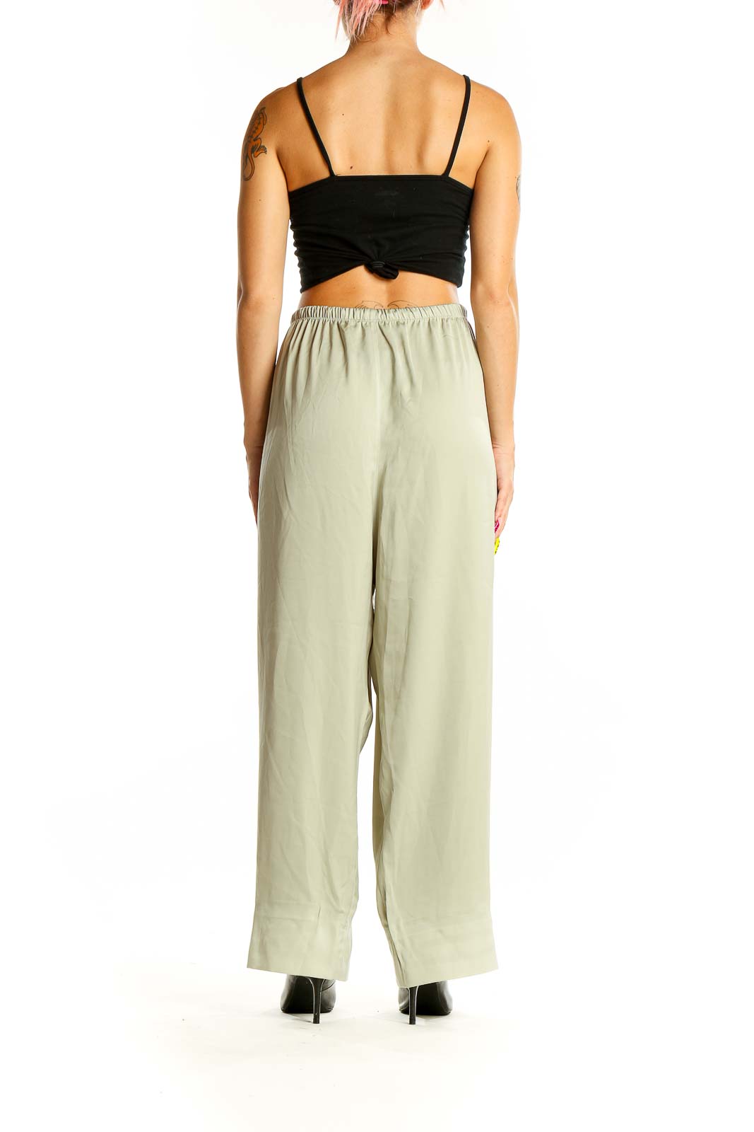 Back view of sage green Uniqlo wide-leg pants on model