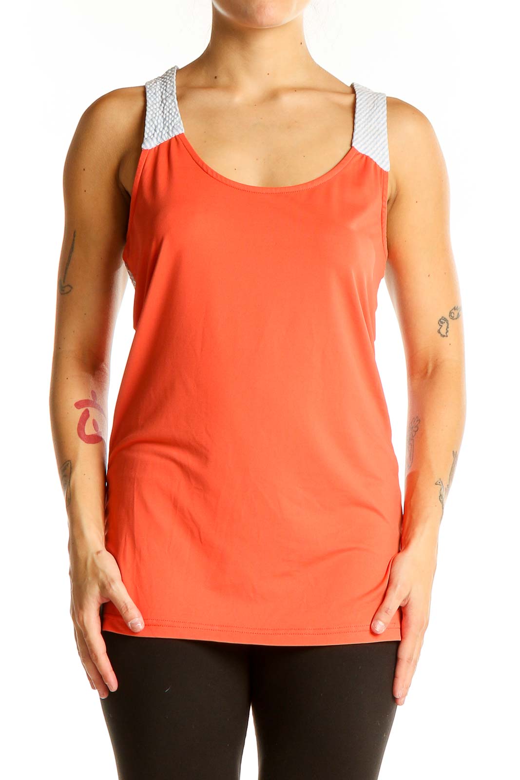 Front view of coral athletic tank top with white mesh straps