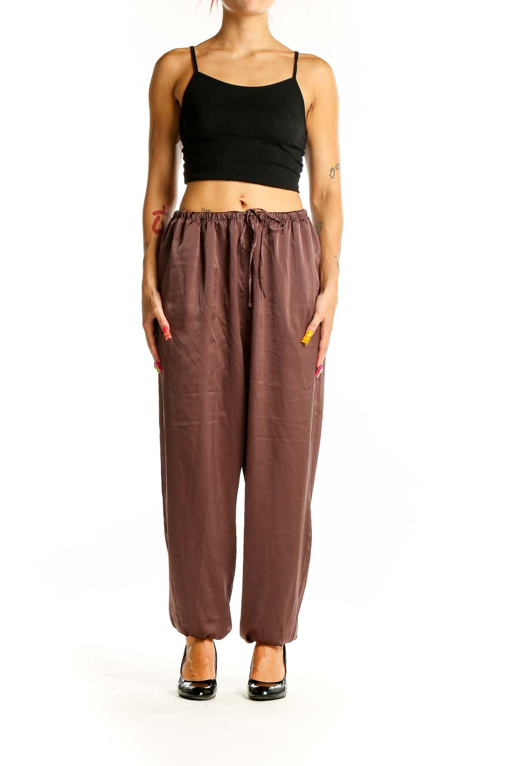 Front view of brown Uniqlo relaxed fit pants with drawstring waist