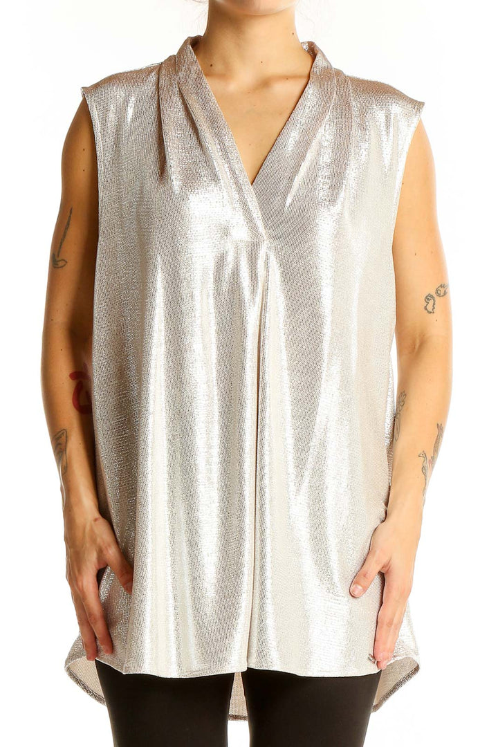 Front view of Calvin Klein silver sleeveless V-neck blouse on model