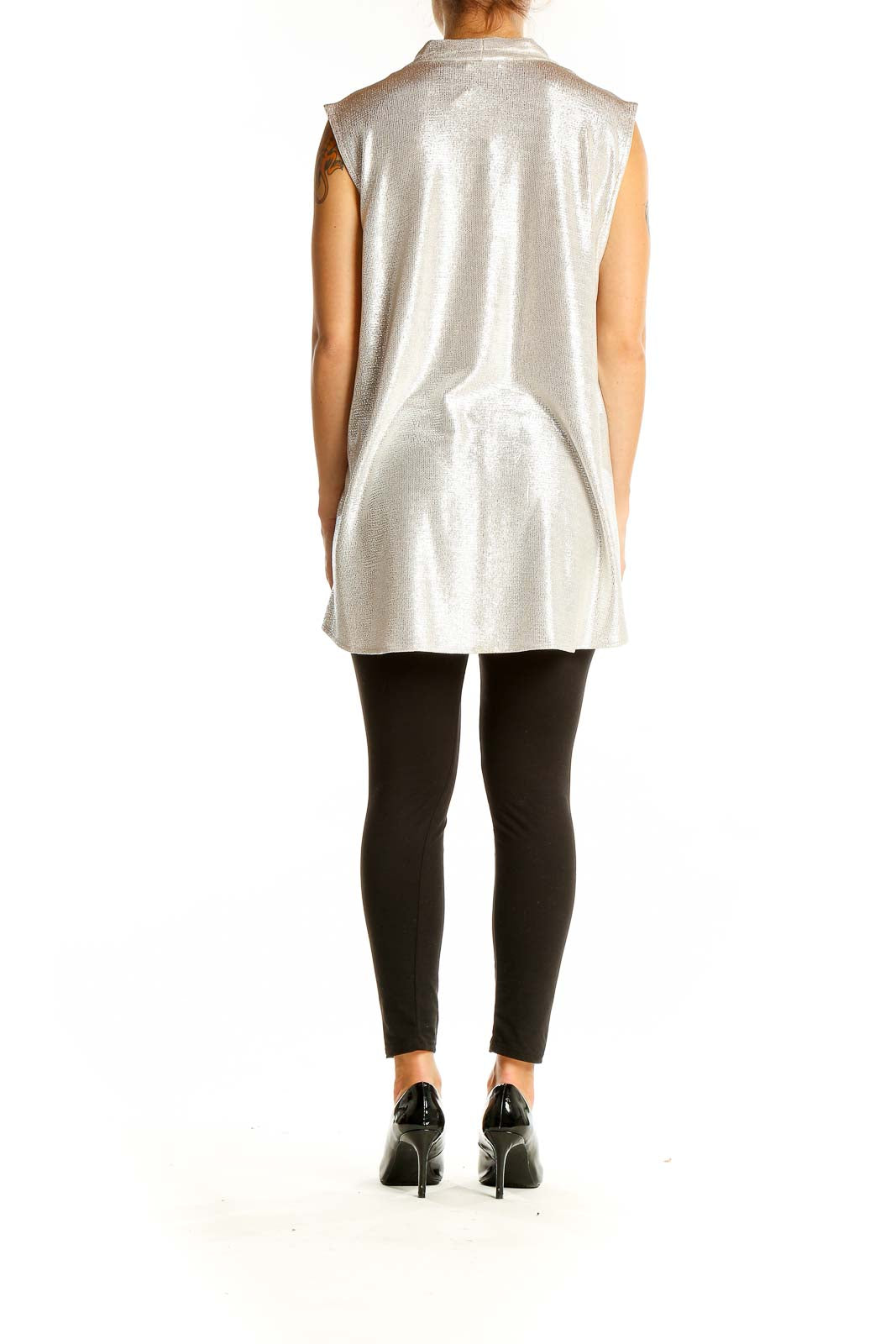 Back view of Calvin Klein silver sleeveless blouse showing drape and length