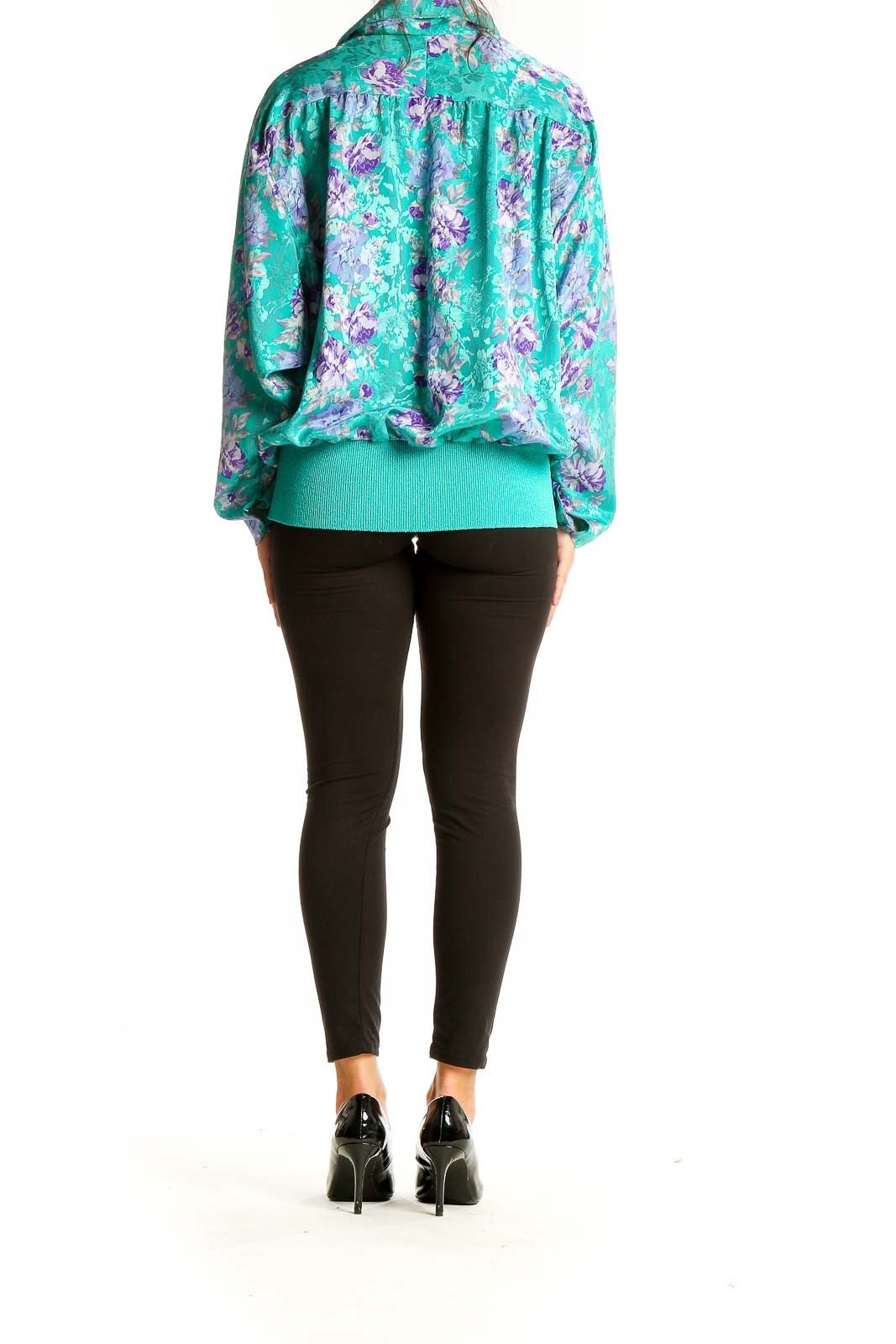 Back view of teal floral print blouse showing relaxed fit and elastic waistband