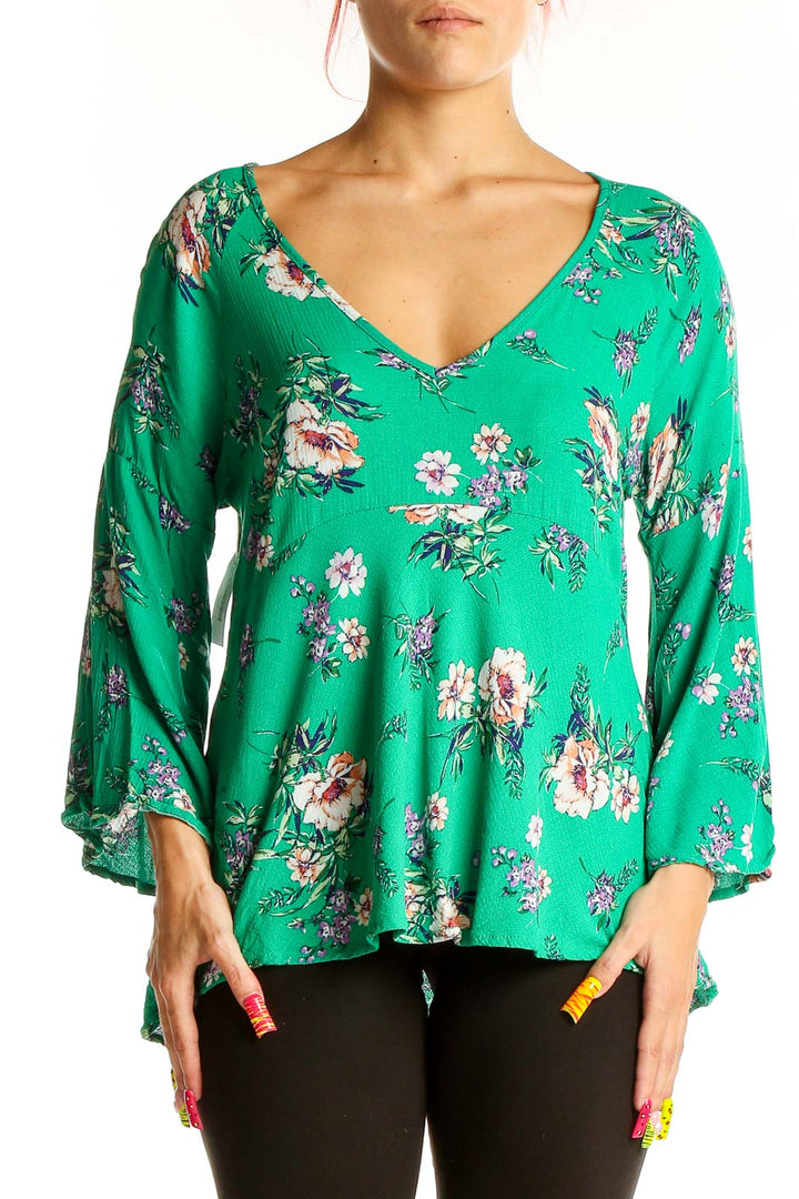 Front view of Rachel Zoe green floral blouse with bell sleeves