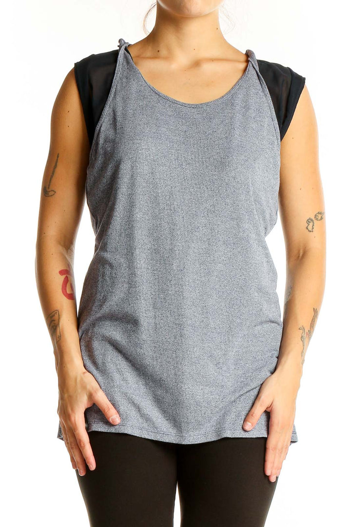 Front view of gray ribbed athletic tank top with black mesh panels