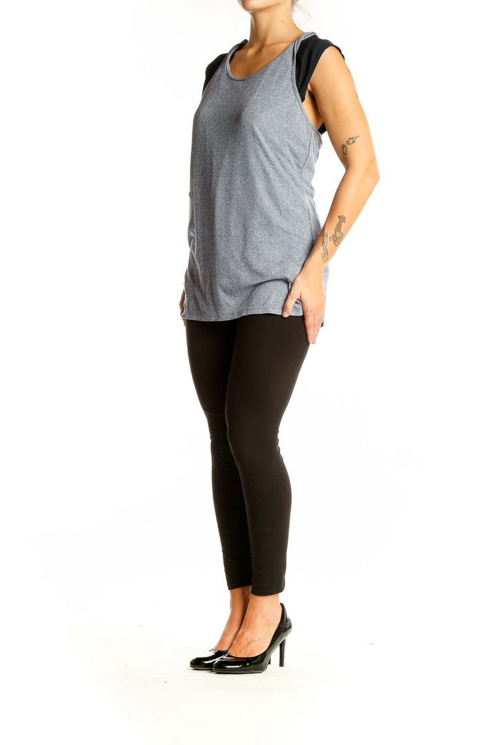 Front view of gray ribbed athletic tank top with black mesh panels