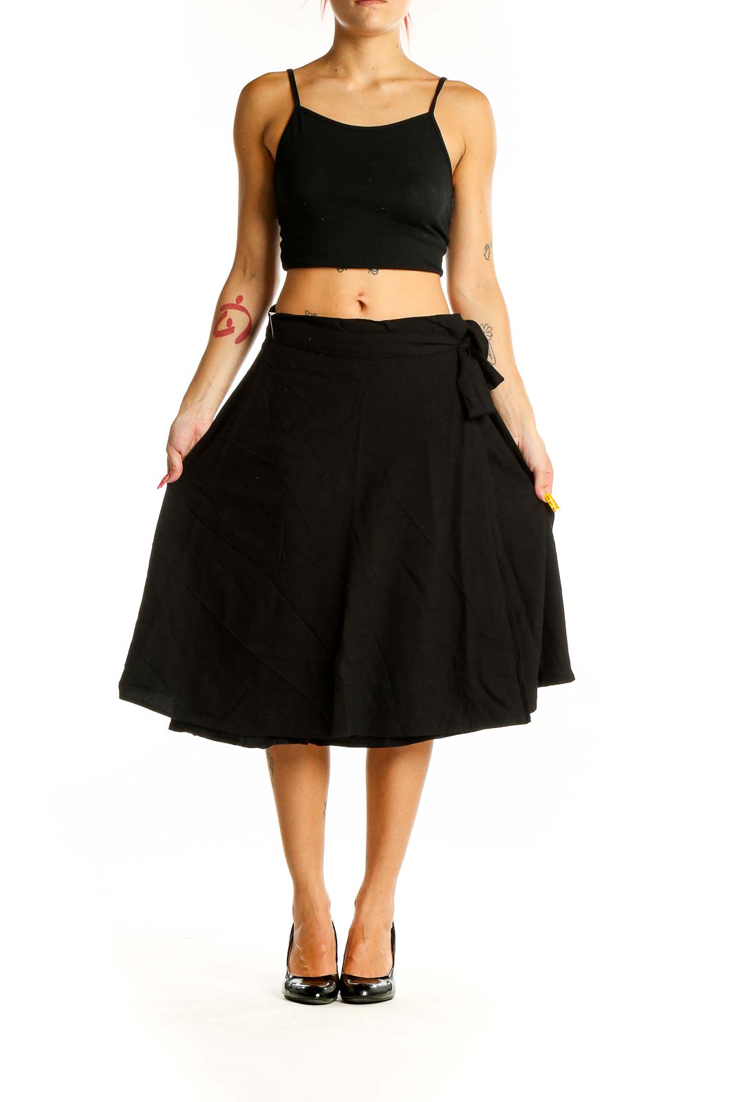 Front view of black A-line midi skirt with tie waist detail