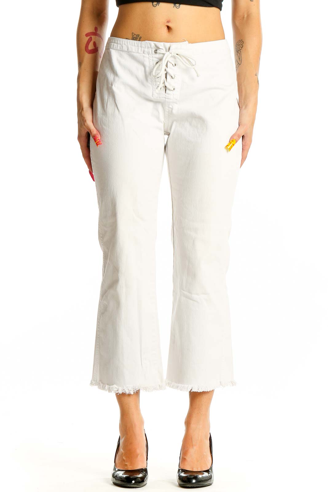 Front view of white lace-up cropped denim jeans from Express