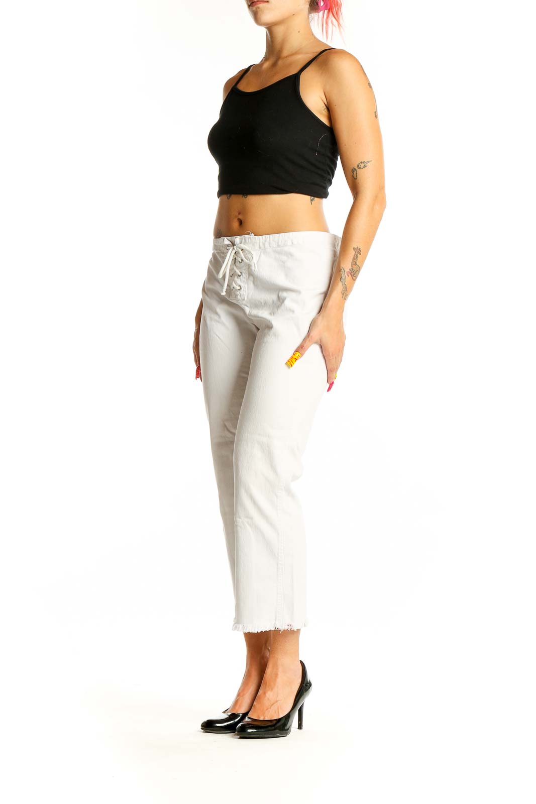 Front view of white lace-up cropped denim jeans from Express