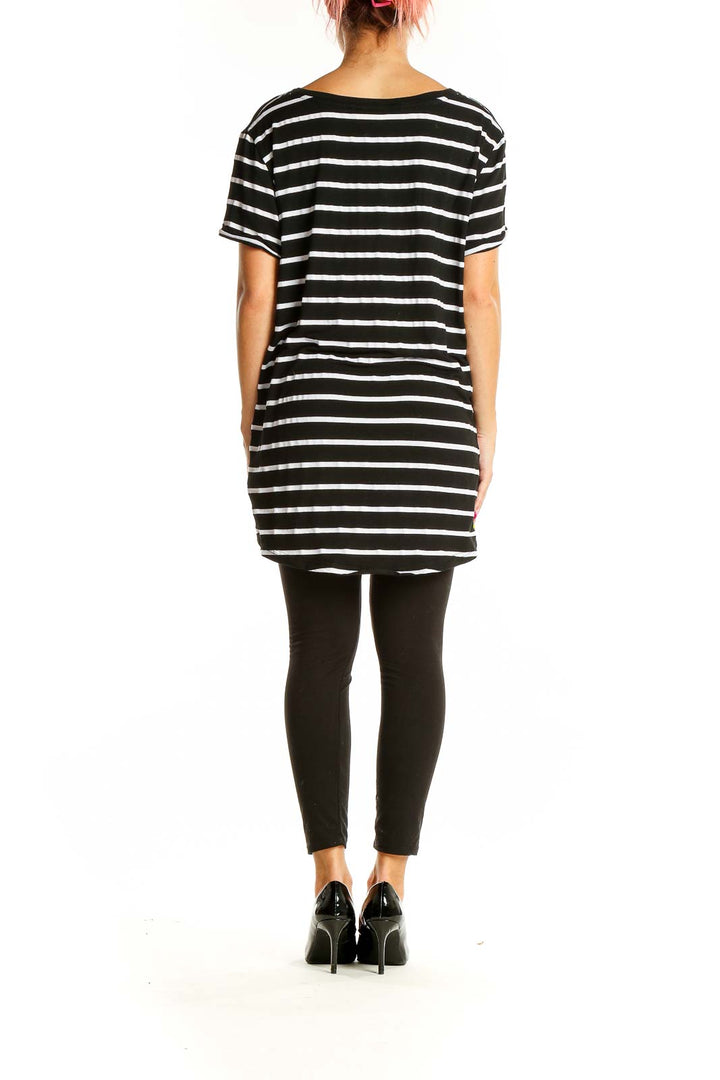 Back view of Black and White Striped Oversized Top from Fervour showing longer length