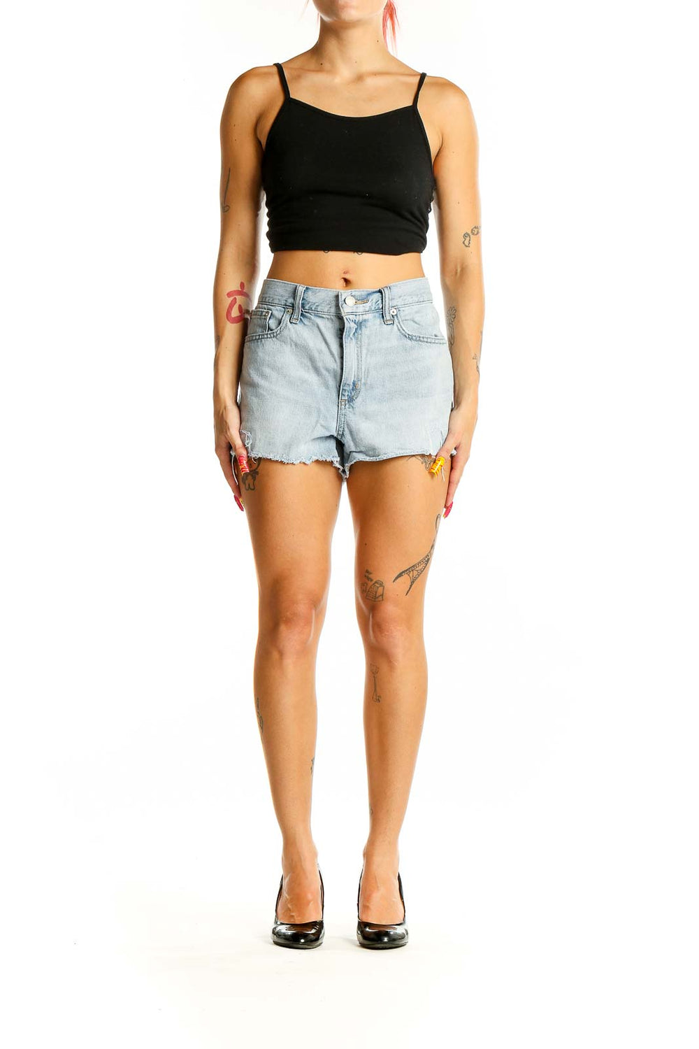 Front view of Gap light blue distressed denim shorts on model