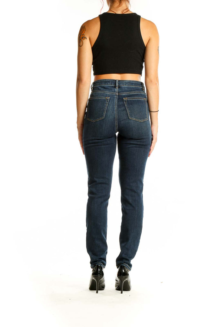 Back view of Elie Tahari dark blue slim fit jeans on model