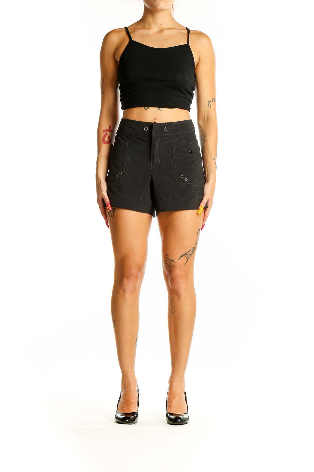 Front view of black Athleta activewear shorts with zip pockets