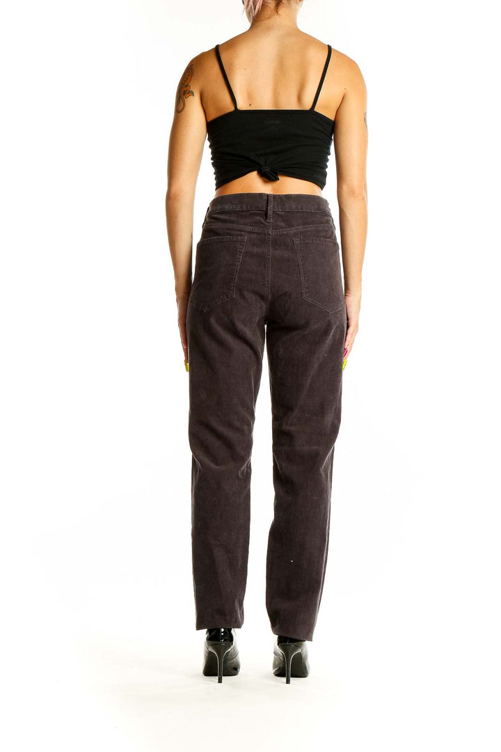 Back view of Ann Taylor LOFT brown corduroy straight-leg pants on model