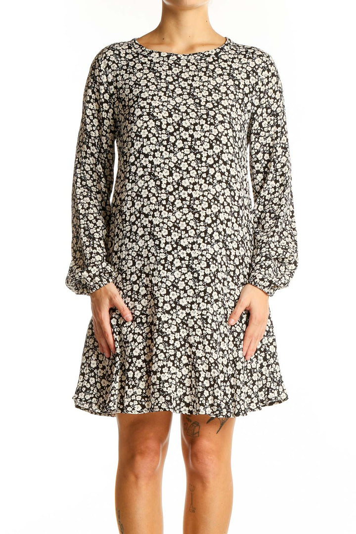 Front view of Gap black floral print mini dress with long sleeves