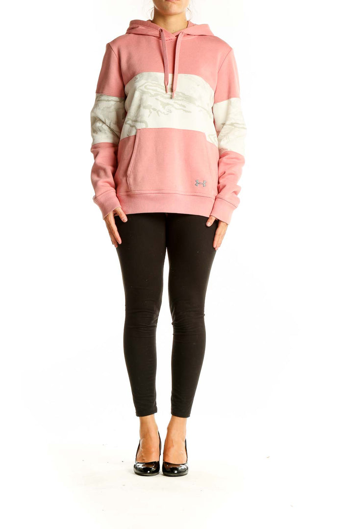 Front view of pink and white Under Armour color block hoodie