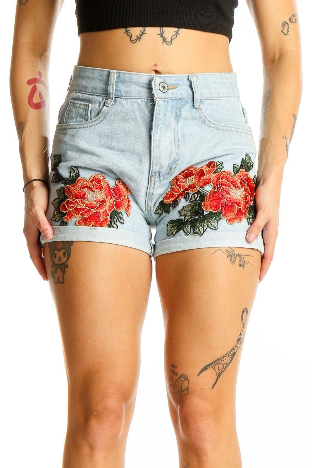 Front view of light blue denim shorts with red floral embroidery