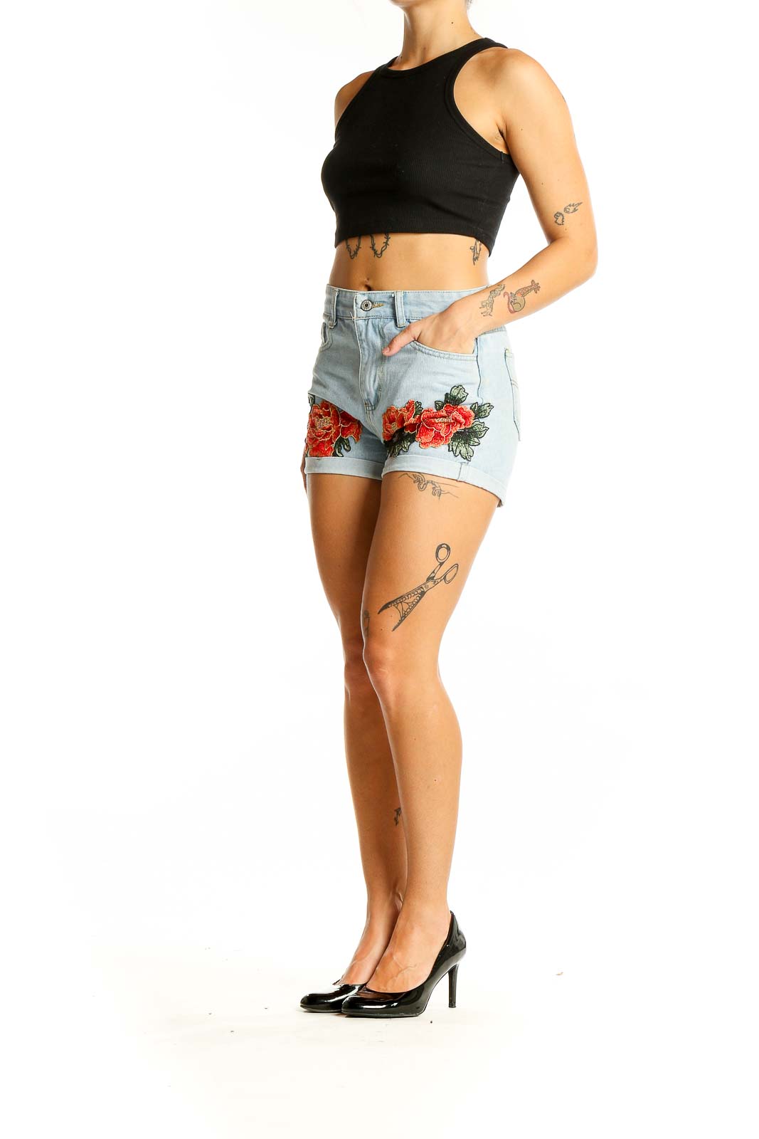 Front view of light blue denim shorts with red floral embroidery