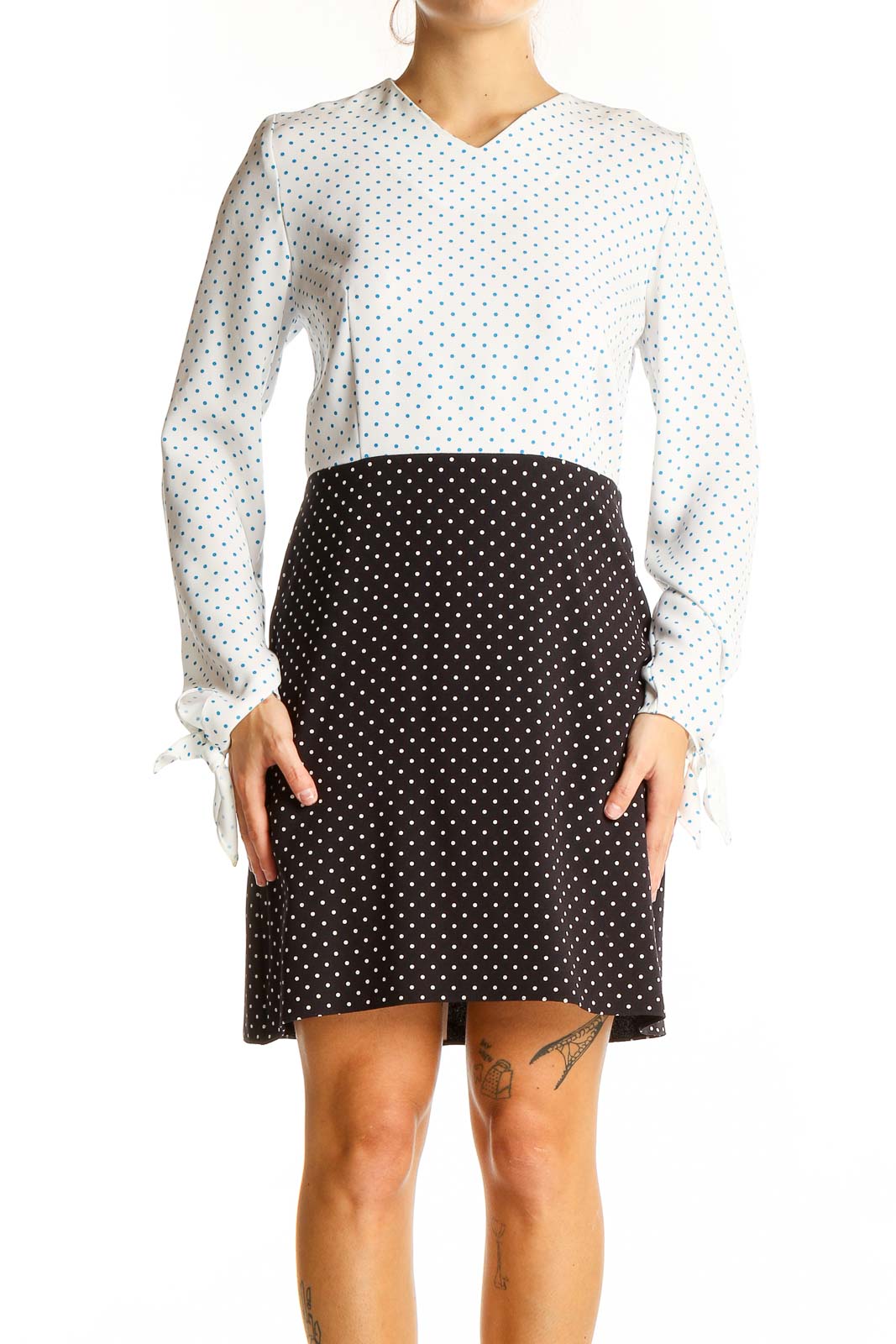 Front view of JW Anderson white and black polka dot contrast dress with long sleeves