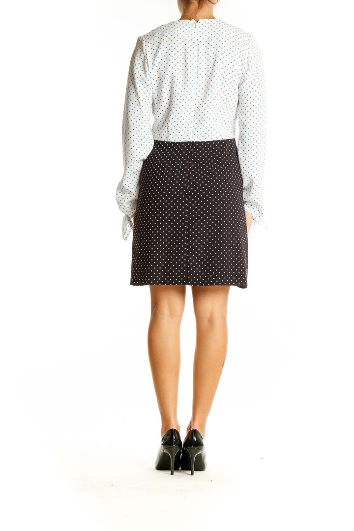 Back view of JW Anderson polka dot contrast dress showing white top and black bottom design