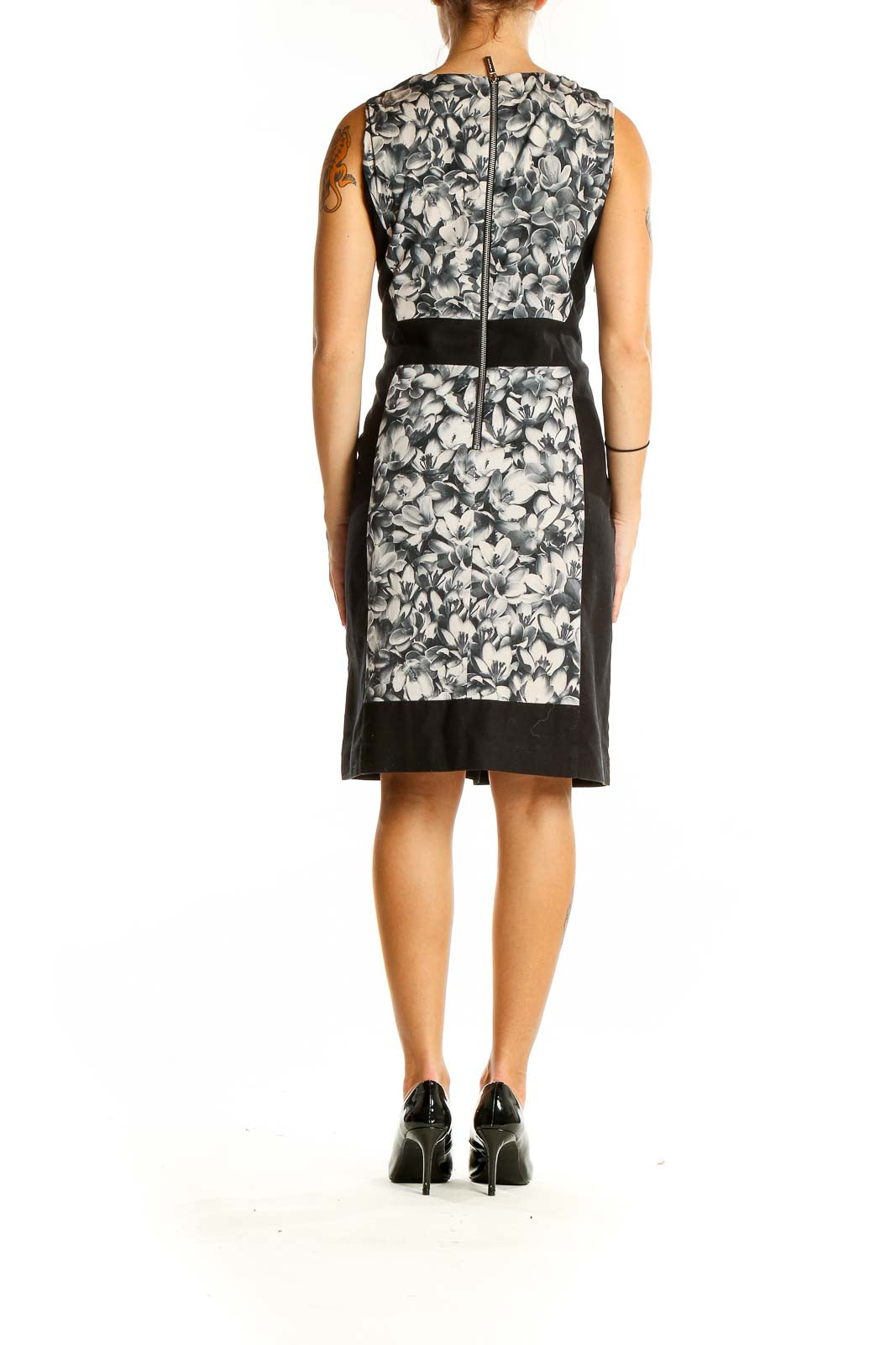 Back view of MICHAEL Michael Kors black and white floral sheath dress with zipper closure